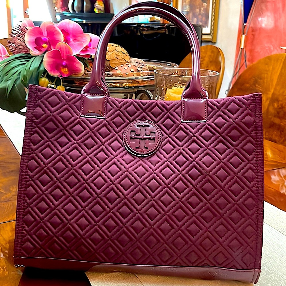 It’s a beautiful  mini  Tory Burch bag the color is like eggplant .